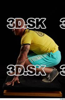 Kneeling reference of whole body yellow shirt turquoise shorts brown…